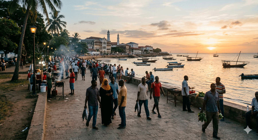 Forodhani i Stone Town vid solnedgången med strandpromenad, människor och varm kvällsstämning
